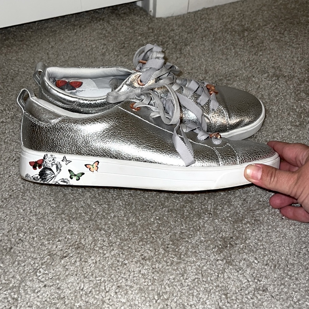 Ted Baker silver tennis shoes with butterfly accent, size 9.5, good cond. & cool